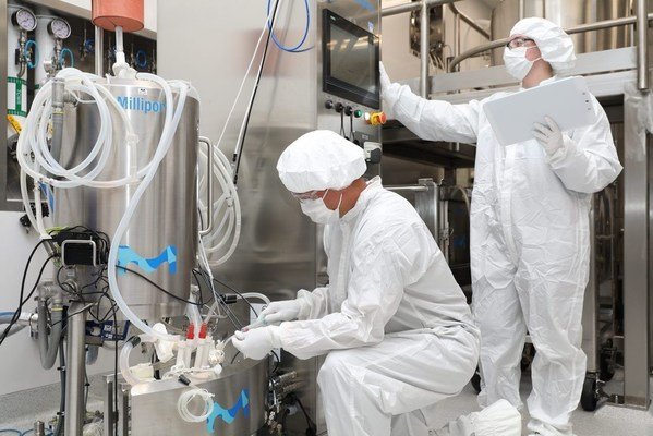 Merck scientists operating a 200 L Mobius® Single-Use Bioreactor using the VirusExpress® 293 Adeno-Associated Virus Production Platform at the company